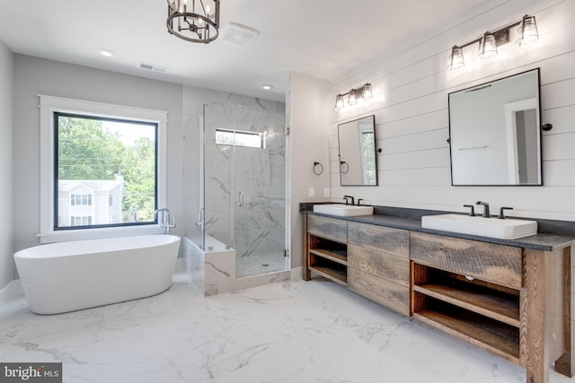 bathroom with visible vents, marble finish floor, a sink, and a marble finish shower