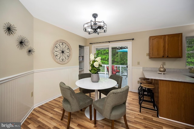 55 Hamn, Stafford, VA 22554 - dining space featuring wainscoting, a chandelier, and light wood-style floors