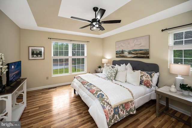 55 Hamn, Stafford, VA 22554 - bedroom featuring a raised ceiling, baseboards, a ceiling fan, and wood finished floors