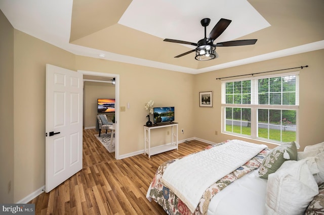 55 Hamn, Stafford, VA 22554 - bedroom featuring a raised ceiling, baseboards, a ceiling fan, and wood finished floors