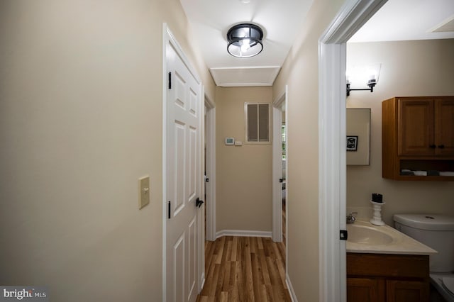 55 Hamn, Stafford, VA 22554 - doorway to outside with a sink, light wood-style flooring, baseboards, and visible vents