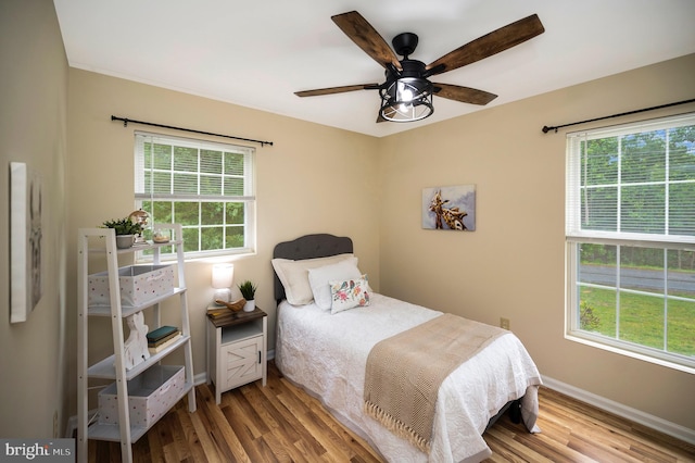 55 Hamn, Stafford, VA 22554 - bedroom featuring multiple windows, wood finished floors, and baseboards