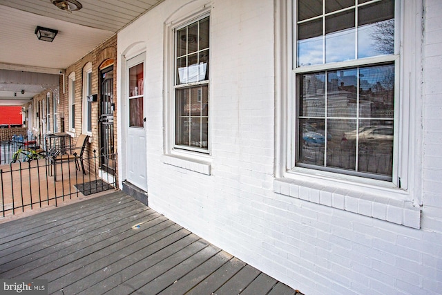 wooden terrace with a porch