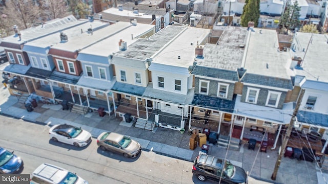 birds eye view of property with a residential view