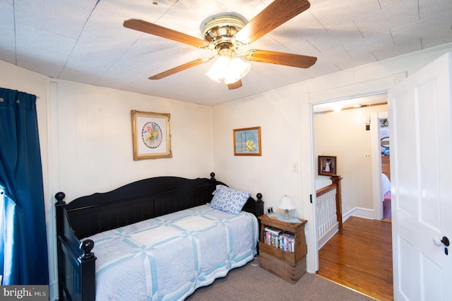 bedroom with wood finished floors and ceiling fan
