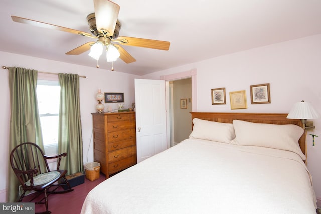 bedroom featuring dark wood-style flooring and a ceiling fan