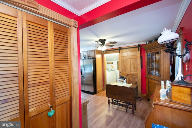 kitchen with ornamental molding, a ceiling fan, stainless steel fridge with ice dispenser, and wood finished floors