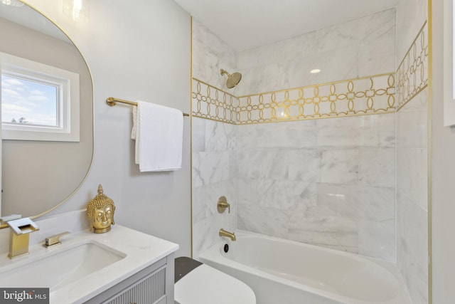 bathroom with toilet, vanity, and tub / shower combination