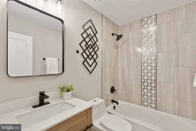 bathroom with tub / shower combination, toilet, and vanity