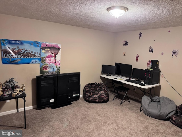 office featuring carpet floors and a textured ceiling