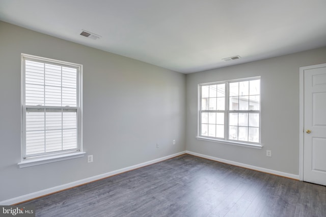 1055 Gardenview Loop Unit 402, Woodbridge, VA 22191 - spare room with visible vents, baseboards, and wood finished floors