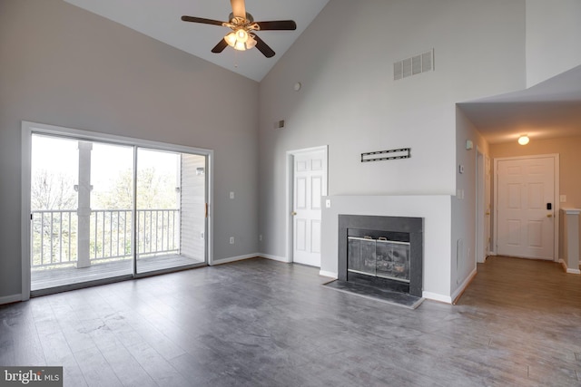 1055 Gardenview Loop Unit 402, Woodbridge, VA 22191 - unfurnished living room featuring a glass covered fireplace, a ceiling fan, visible vents, wood finished floors, and baseboards