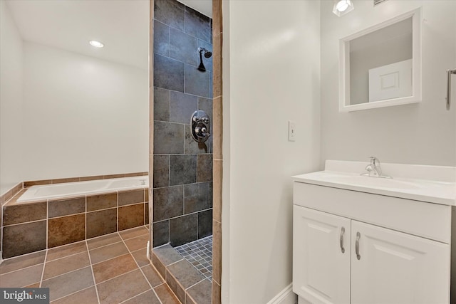 full bathroom featuring tile patterned flooring, vanity, a tile shower, and a bath