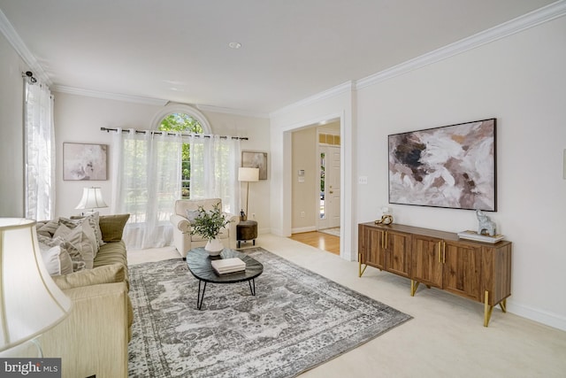 living room with crown molding, baseboards, and light carpet