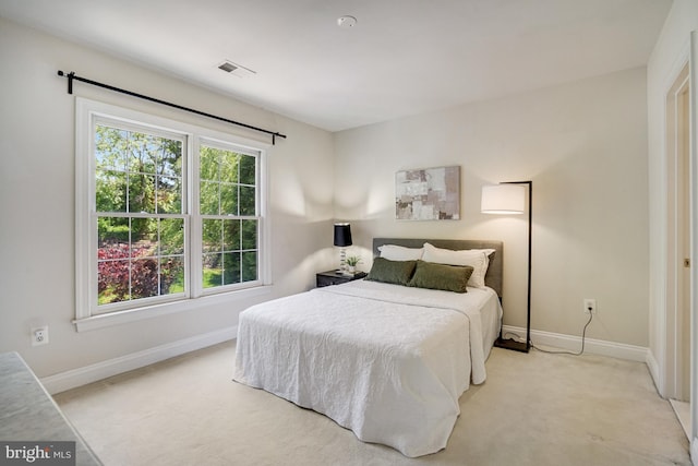 bedroom featuring baseboards, carpet, and visible vents