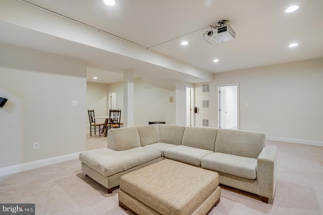living room with baseboards, recessed lighting, and light colored carpet