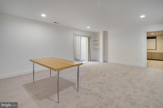 unfurnished office featuring recessed lighting, baseboards, visible vents, and light colored carpet