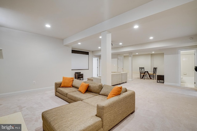 living room featuring recessed lighting, baseboards, and light colored carpet