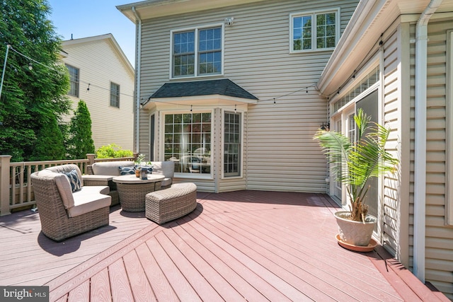 wooden deck featuring outdoor lounge area