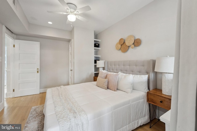 bedroom featuring recessed lighting, a ceiling fan, visible vents, baseboards, and wood finished floors