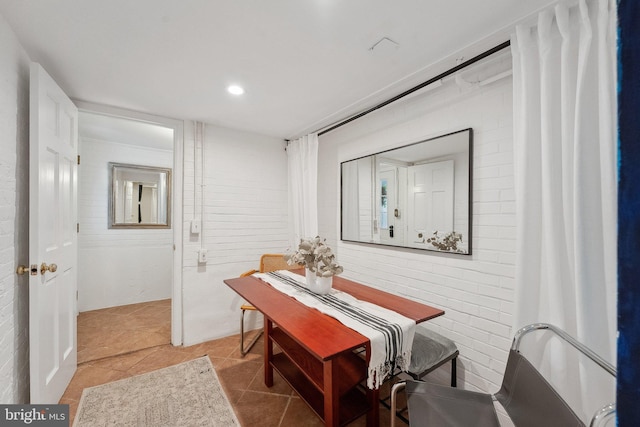 dining space featuring light tile patterned floors