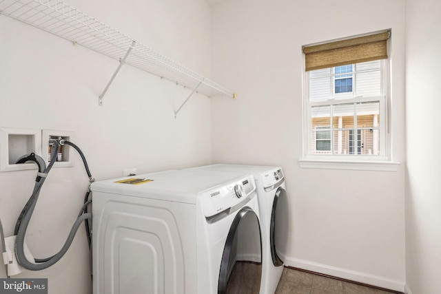 washroom featuring baseboards, laundry area, tile patterned floors, and washer and dryer