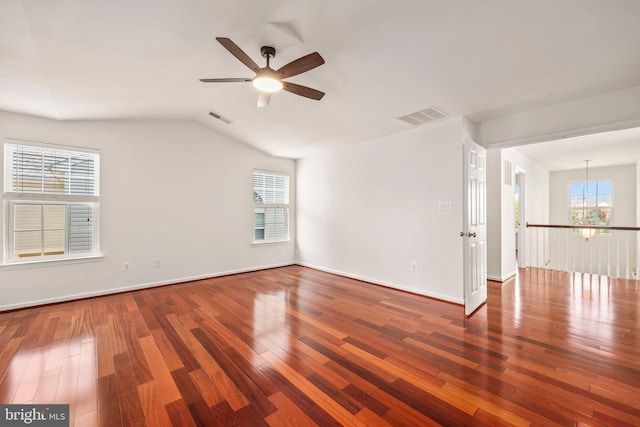 spare room with visible vents, a ceiling fan, and wood finished floors