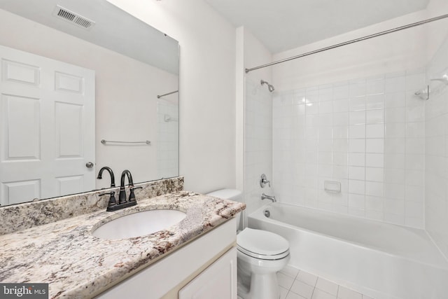 full bathroom with visible vents, vanity, toilet, washtub / shower combination, and tile patterned floors