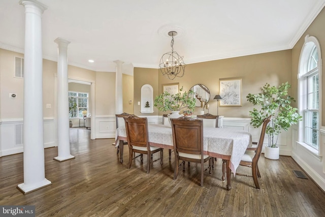 dining area with plenty of natural light, ornate columns, and dark wood-type flooring