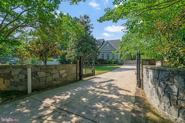 view of gate with fence