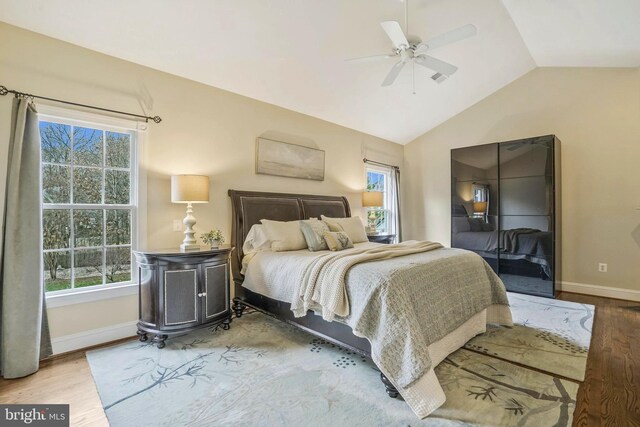 2504 Sherwood Hall Ln, Alexandria, VA 22306 - bedroom with baseboards, wood finished floors, vaulted ceiling, and multiple windows