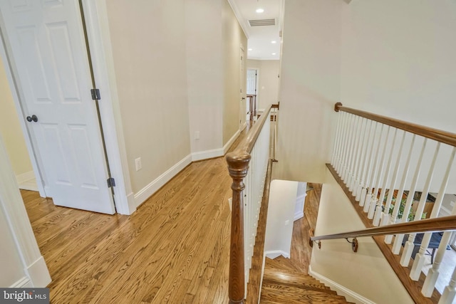 2504 Sherwood Hall Ln, Alexandria, VA 22306 - hall with baseboards, an upstairs landing, visible vents, and light wood-style floors