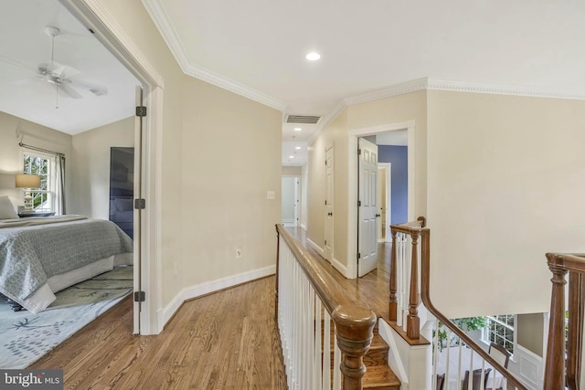 2504 Sherwood Hall Ln, Alexandria, VA 22306 - hall with visible vents, wood finished floors, baseboards, ornamental molding, and recessed lighting