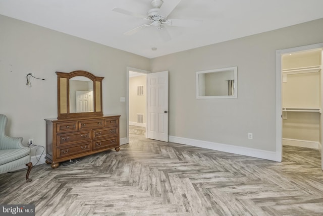 2504 Sherwood Hall Ln, Alexandria, VA 22306 - bedroom with baseboards, ceiling fan, a walk in closet, and visible vents