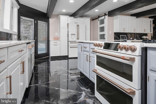 kitchen with marble finish floor, white appliances, beamed ceiling, and white cabinetry