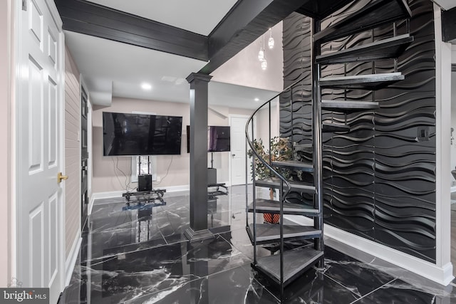interior space with marble finish floor, baseboards, recessed lighting, and ornate columns