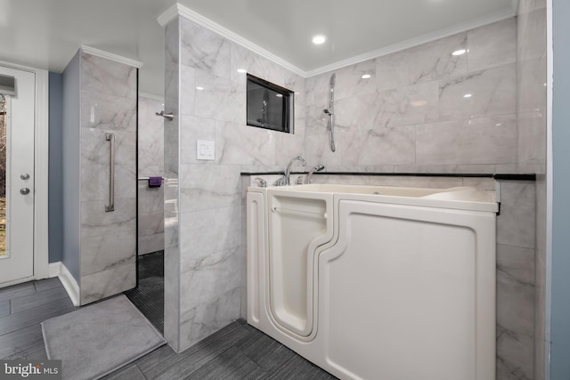 full bathroom with crown molding, tile walls, and a walk in shower