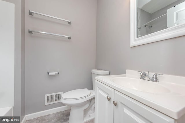 2118 E Hoffman St, Baltimore, MD 21213 - bathroom featuring toilet, vanity, walk in shower, baseboards, and visible vents