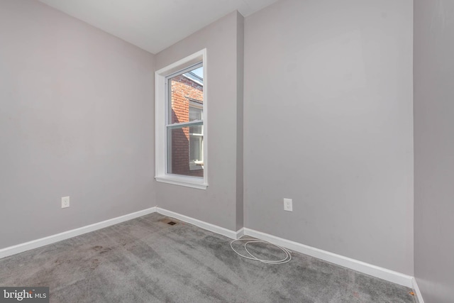 2118 E Hoffman St, Baltimore, MD 21213 - spare room featuring baseboards, visible vents, and carpet floors