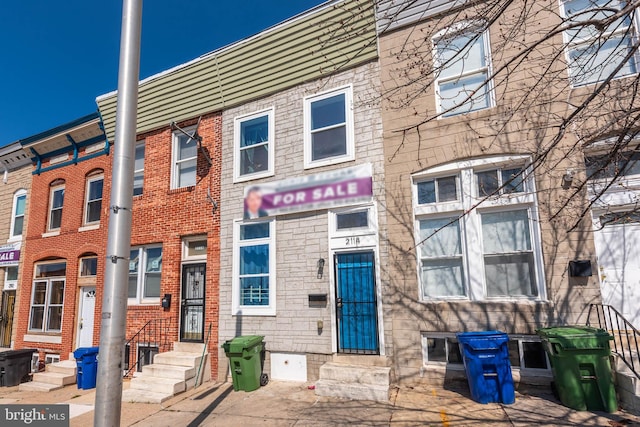 2118 E Hoffman St, Baltimore, MD 21213 - townhome / multi-family property featuring brick siding and entry steps