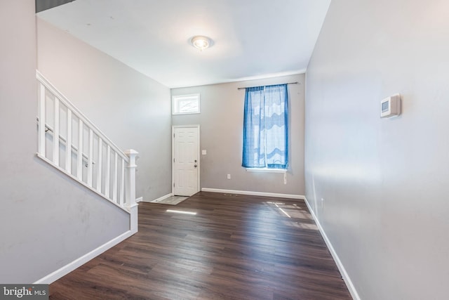 2118 E Hoffman St, Baltimore, MD 21213 - entryway featuring baseboards, stairs, and wood finished floors