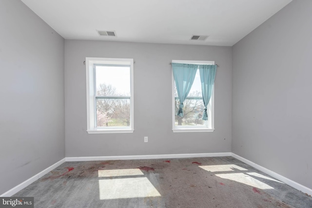 2118 E Hoffman St, Baltimore, MD 21213 - empty room with baseboards, a wealth of natural light, and visible vents