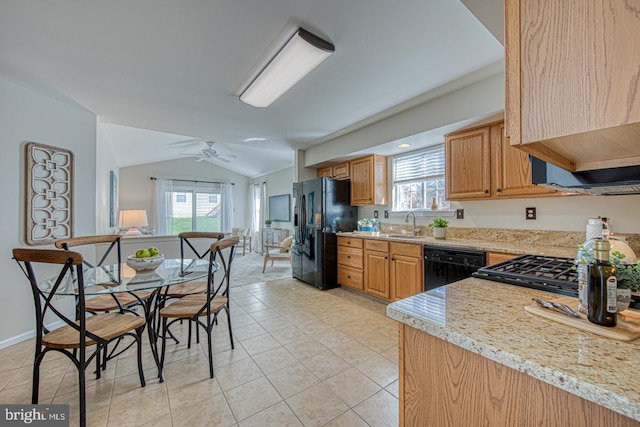 kitchen with light tile patterned flooring, vaulted ceiling, a ceiling fan, light countertops, and black appliances