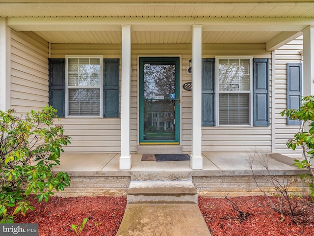 doorway to property with a porch
