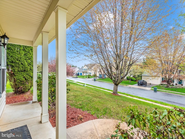 view of patio with a residential view and covered porch