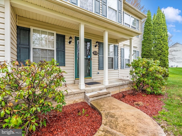 property entrance featuring covered porch