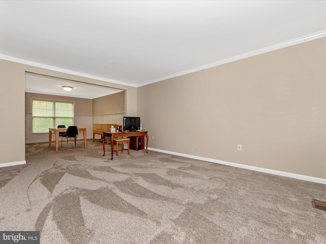 living area featuring carpet, baseboards, and crown molding