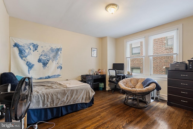 bedroom with dark wood-type flooring