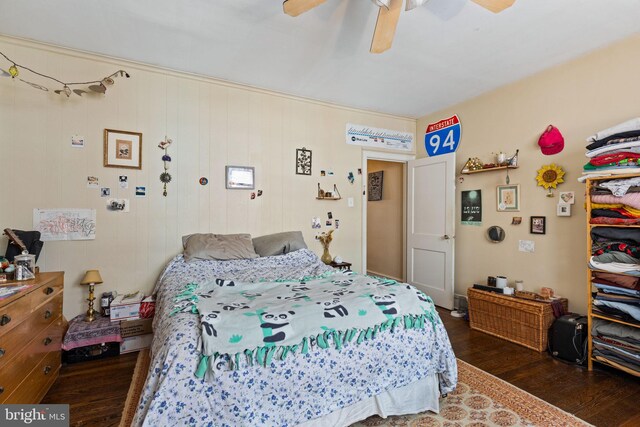 bedroom featuring wood finished floors and ceiling fan