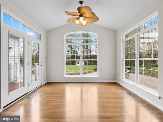 unfurnished sunroom featuring visible vents, french doors, and a healthy amount of sunlight